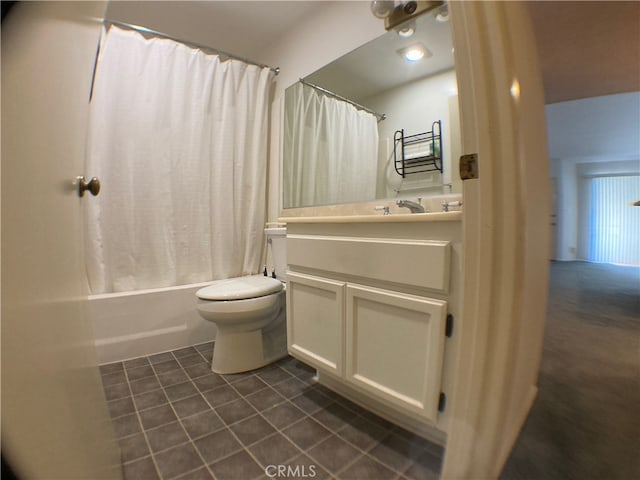 full bathroom with vanity, shower / tub combo, and toilet