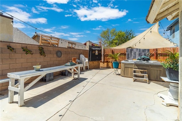 view of patio with a hot tub