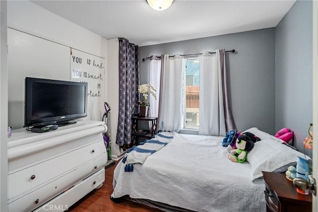 bedroom featuring dark wood-type flooring