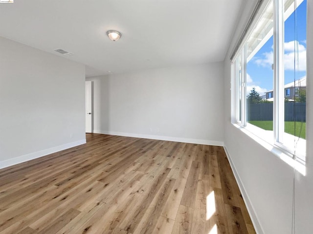 spare room with light wood-type flooring