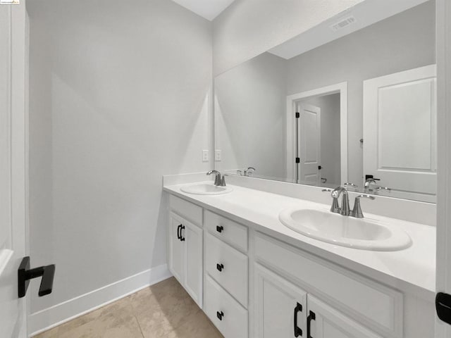 bathroom with tile patterned floors and vanity