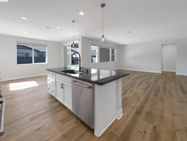 kitchen with white cabinetry, sink, dishwasher, light hardwood / wood-style flooring, and pendant lighting