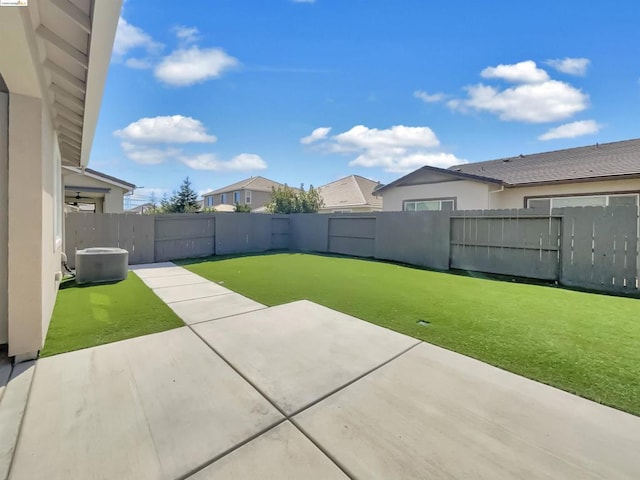 view of yard with a patio and central AC