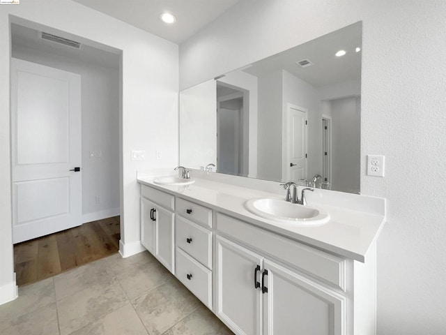 bathroom with vanity and hardwood / wood-style flooring