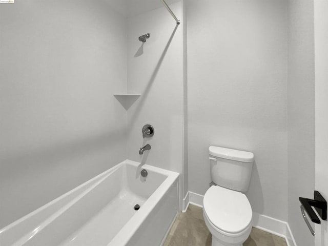 bathroom featuring toilet, tile patterned flooring, and bathing tub / shower combination