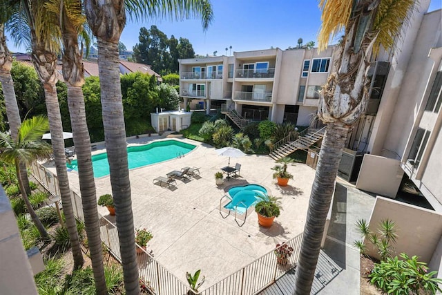 view of swimming pool featuring a patio area