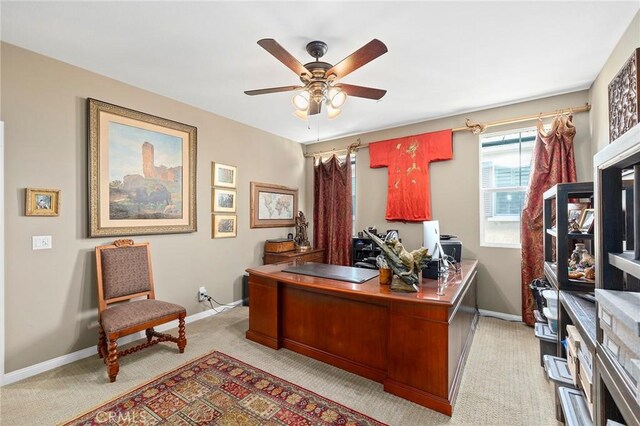 office area featuring ceiling fan and light colored carpet