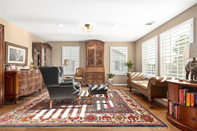 living area with hardwood / wood-style floors