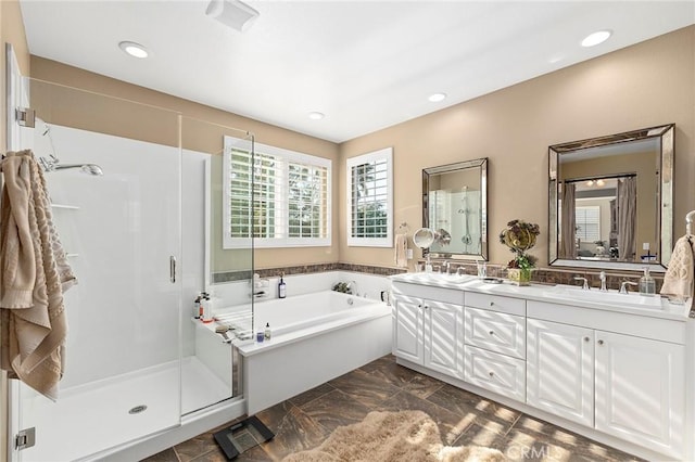 bathroom with vanity and plus walk in shower