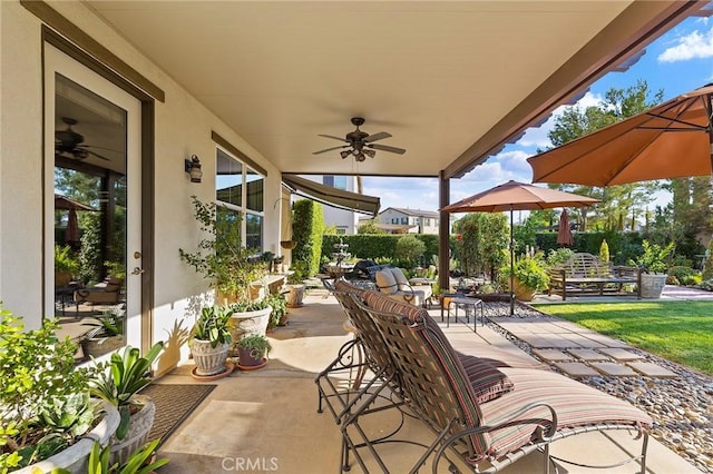 view of patio featuring ceiling fan