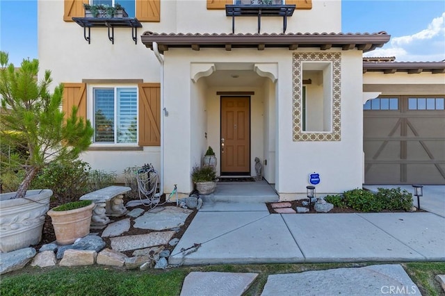 view of exterior entry featuring a garage