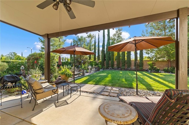 view of patio / terrace featuring ceiling fan and grilling area