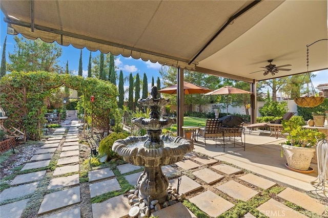 view of patio featuring ceiling fan