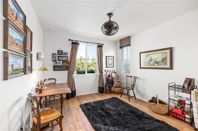 home office with wood-type flooring