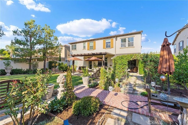 back of house with a patio