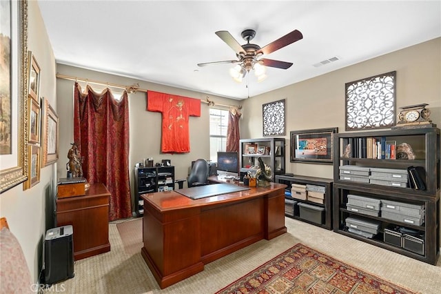 office area with ceiling fan and light colored carpet