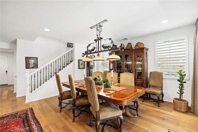 dining room featuring light hardwood / wood-style flooring and a healthy amount of sunlight