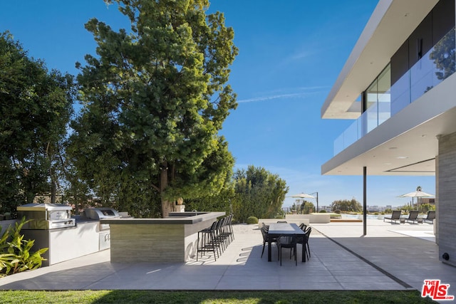 view of patio featuring grilling area and exterior kitchen