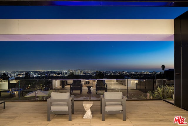 view of patio terrace at dusk