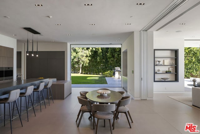 dining room with a wall of windows