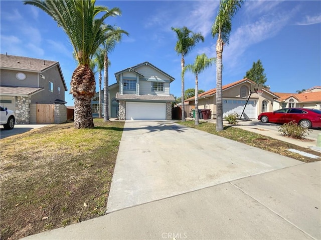 view of front of home featuring a front yard and a garage