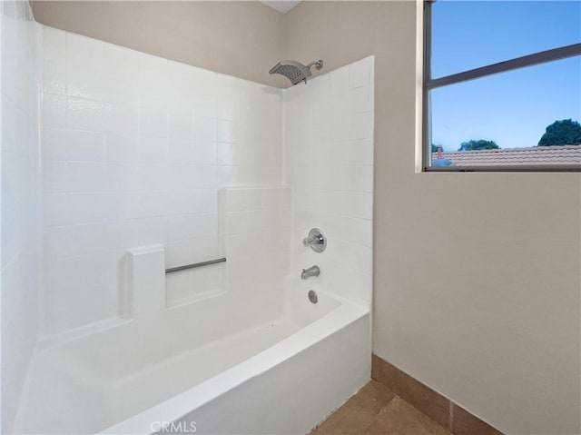 bathroom with tub / shower combination and tile patterned flooring