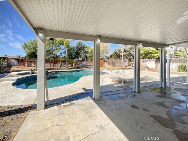 view of swimming pool with a patio area