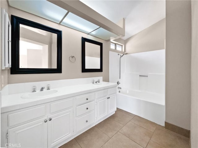 bathroom with vanity, shower / bath combination, and tile patterned flooring