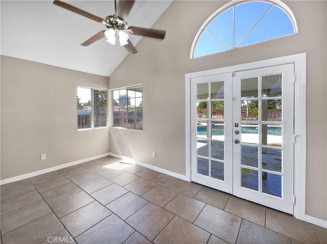 interior space with plenty of natural light, high vaulted ceiling, and french doors