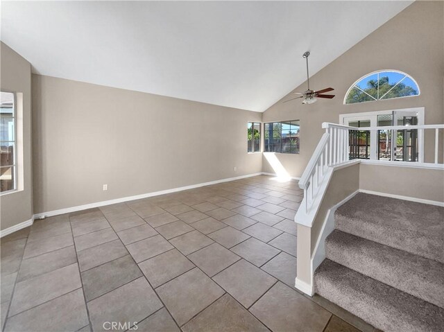 interior space featuring high vaulted ceiling, tile patterned floors, and ceiling fan