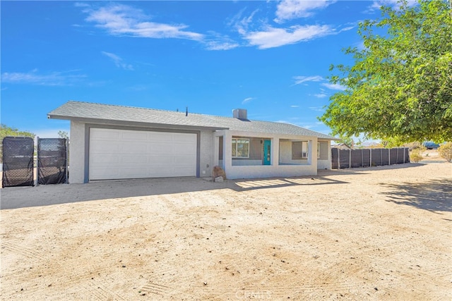 ranch-style house featuring a garage