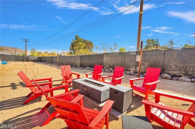 view of patio with a fire pit