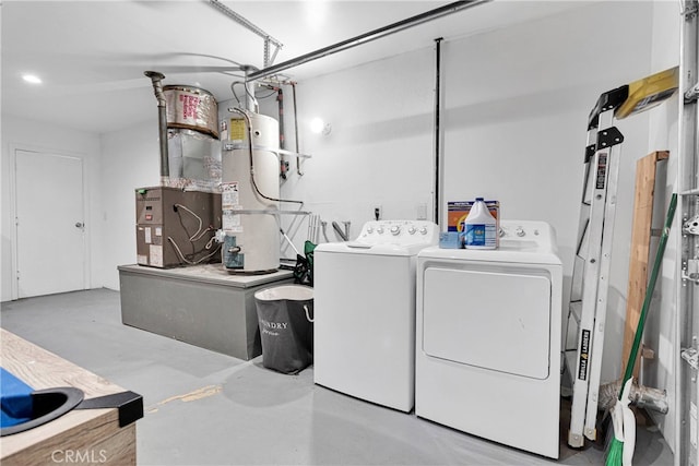 laundry area featuring washing machine and clothes dryer