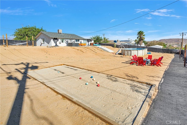 view of yard with a fenced in pool