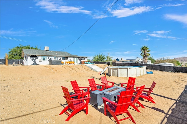 view of yard featuring an outdoor fire pit