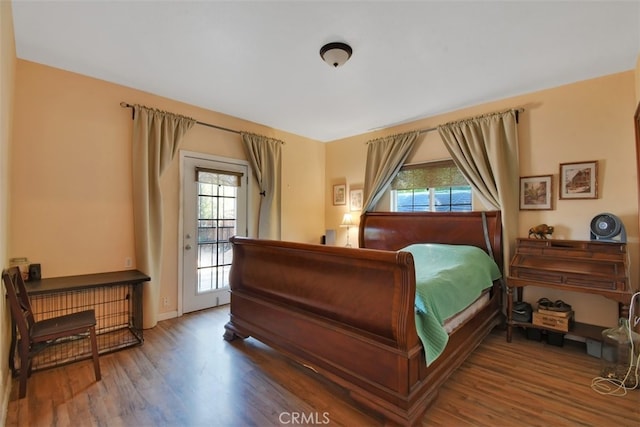 191 Hazel St, Gridley, CA 95948 - bedroom featuring wood finished floors, multiple windows, access to outside, and baseboards