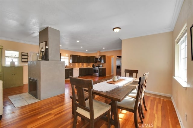 191 Hazel St, Gridley, CA 95948 - dining space with light wood-style flooring, ornamental molding, and baseboards