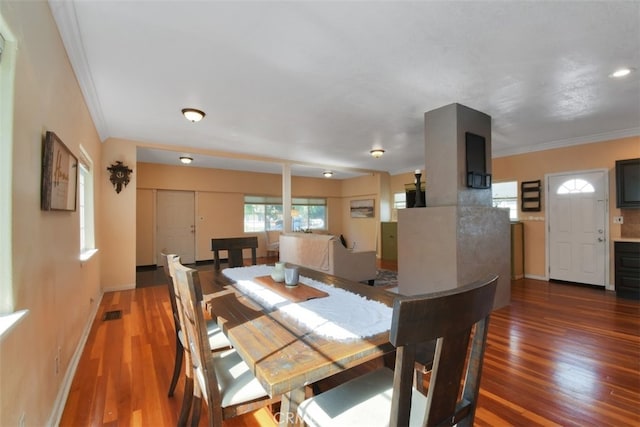 191 Hazel St, Gridley, CA 95948 - dining space with wood finished floors, crown molding, and baseboards