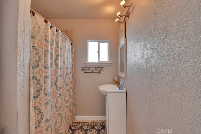 bathroom with vanity and a shower with curtain