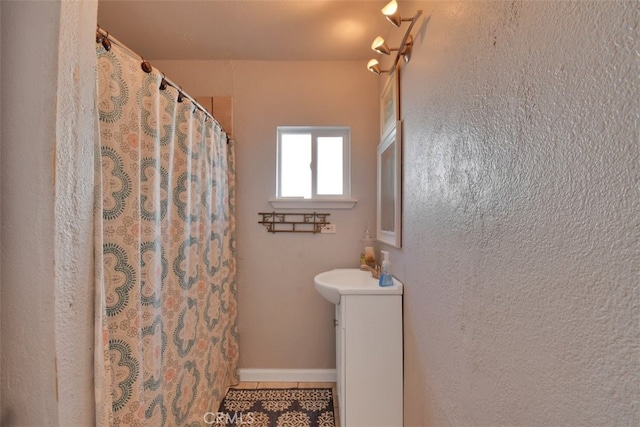 191 Hazel St, Gridley, CA 95948 - full bath with vanity, tile patterned floors, and a shower with shower curtain
