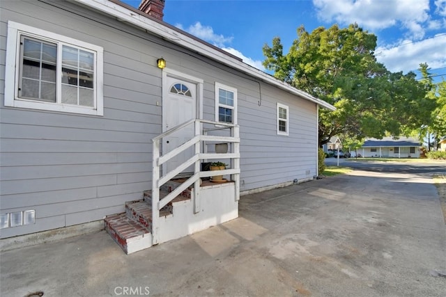 doorway to property featuring a patio