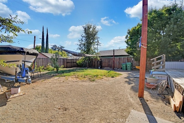 view of yard featuring a wooden deck