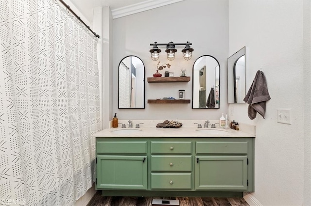 bathroom featuring vanity, ornamental molding, and wood-type flooring