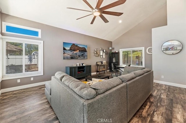 living room with ceiling fan, high vaulted ceiling, wood finished floors, and baseboards