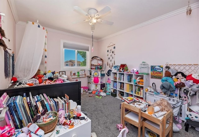 rec room with carpet, ornamental molding, and ceiling fan