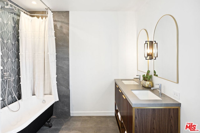 bathroom featuring shower / tub combo with curtain, tile patterned floors, and vanity