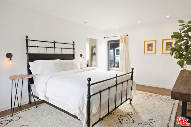 bedroom with light wood-type flooring