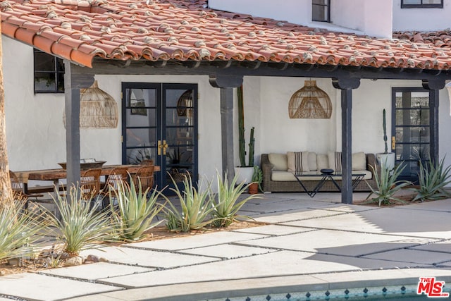 exterior space with a patio area and french doors