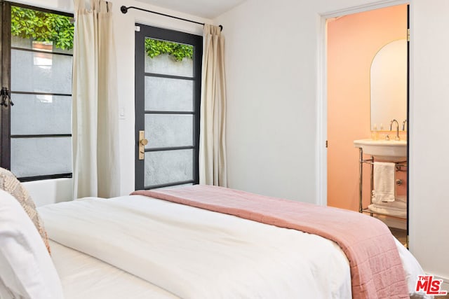 bedroom featuring ensuite bath