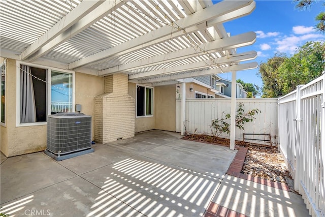 view of patio / terrace with central AC unit and a pergola